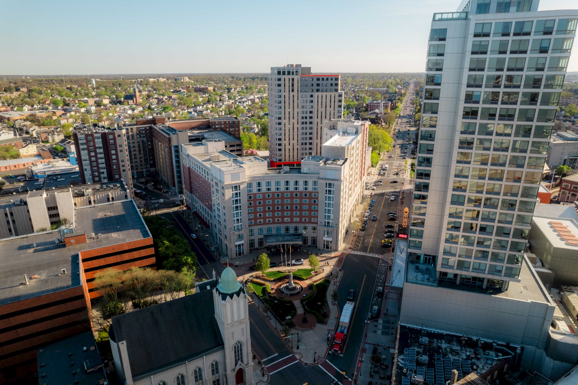 Sky photo of top of The Heldrich hotel and surrounding buildings