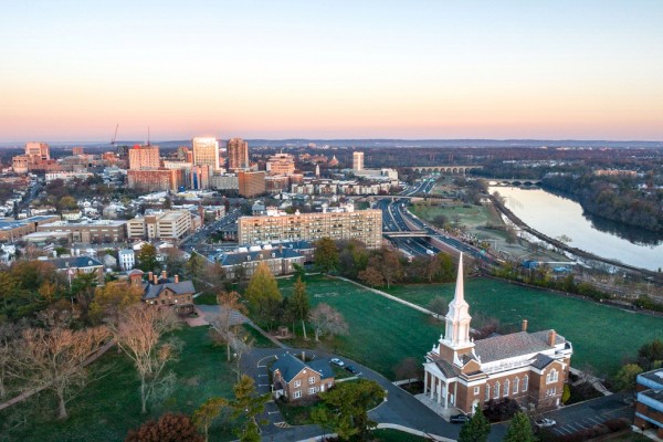 Photo of new jersey from the top showing a church, green scene and buildings on the back